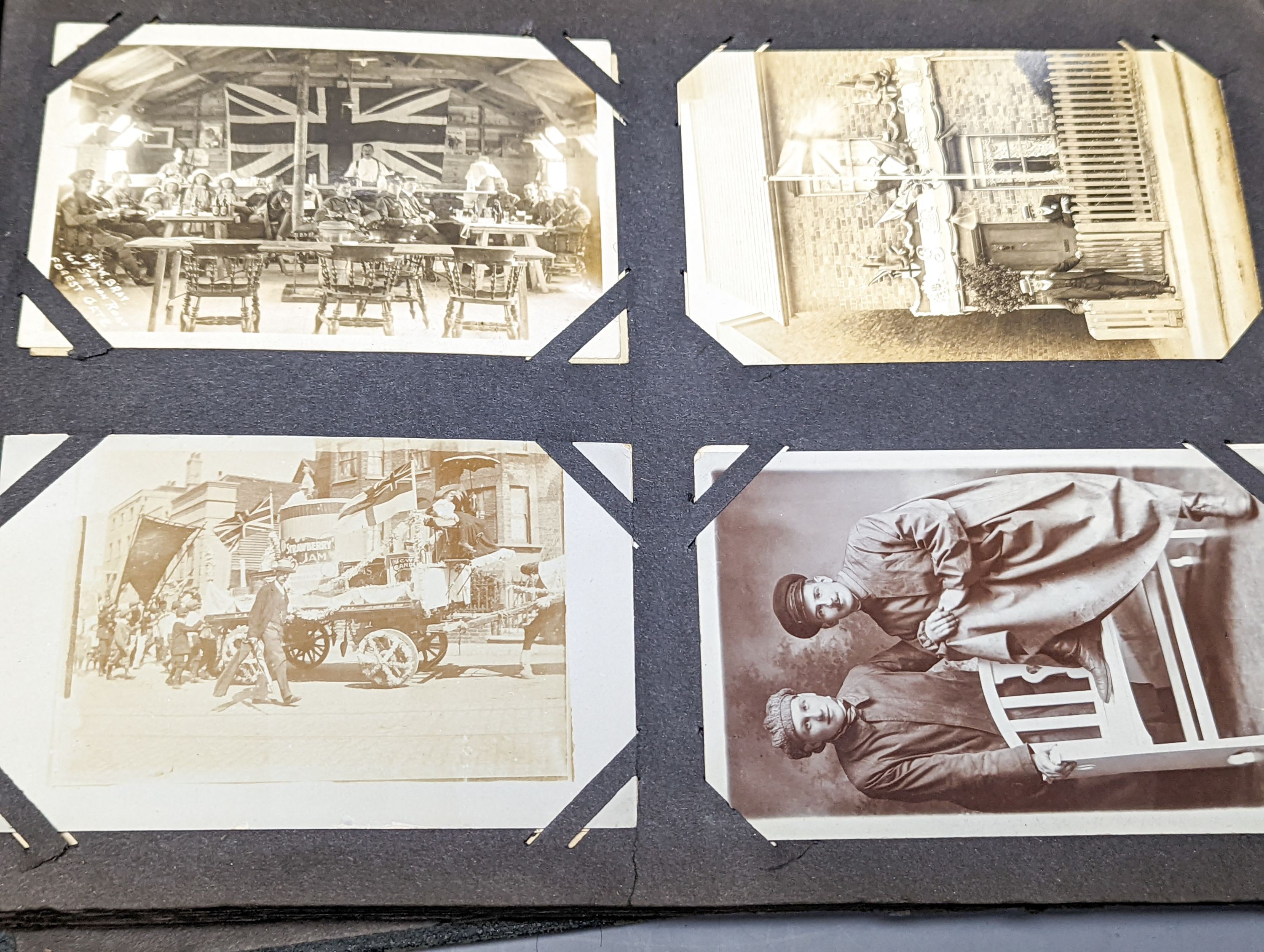 Two early 20th century postcard albums, a photo album and a collection of loose postcards